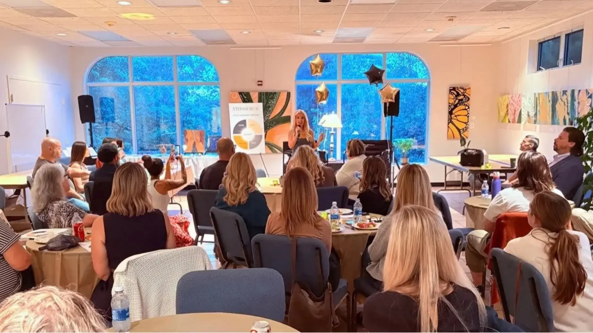 Stefani Seek speaking to a room of Alignment Alliance members